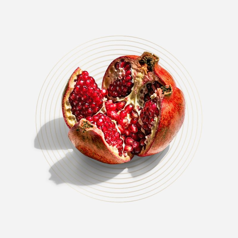 Fresh pomegranate with seeds exposed, highlighting health benefits.